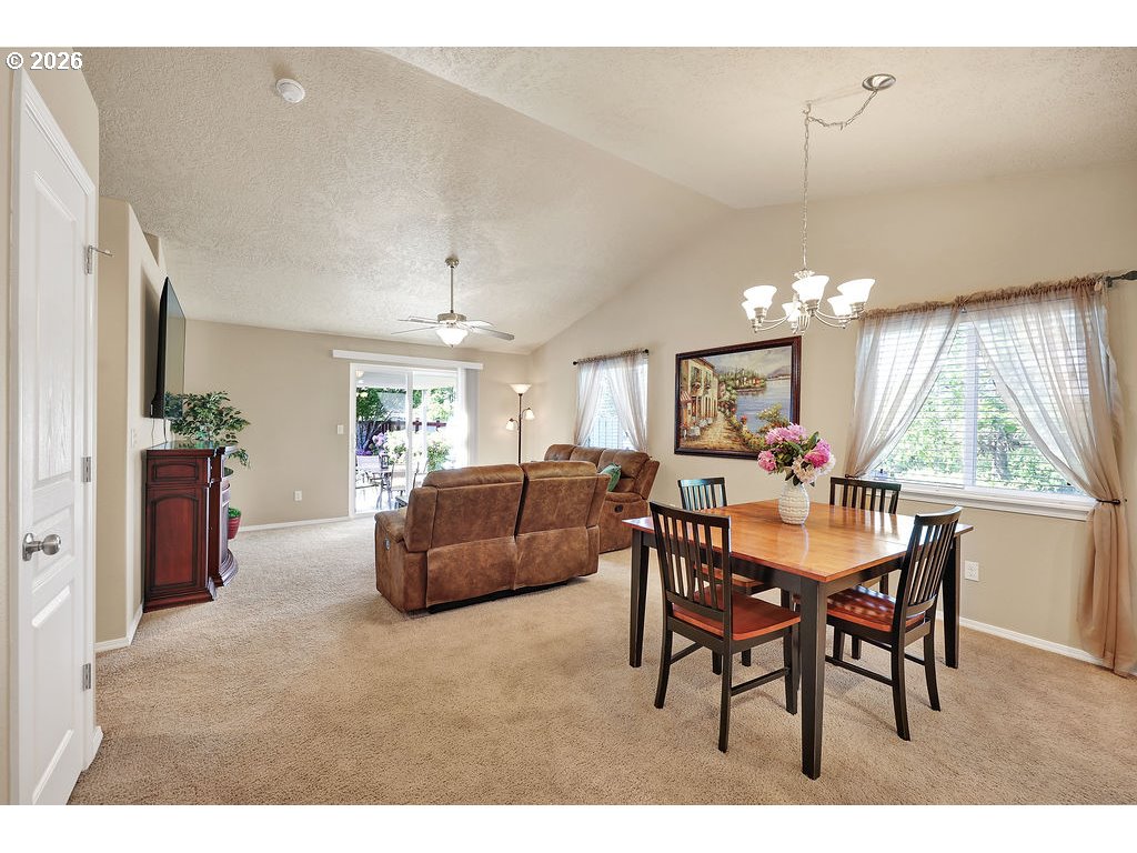 87836 8th Street Veneta, OR 97487 - Photo 10 of 25 a view of a dining room with furniture and a chandelier