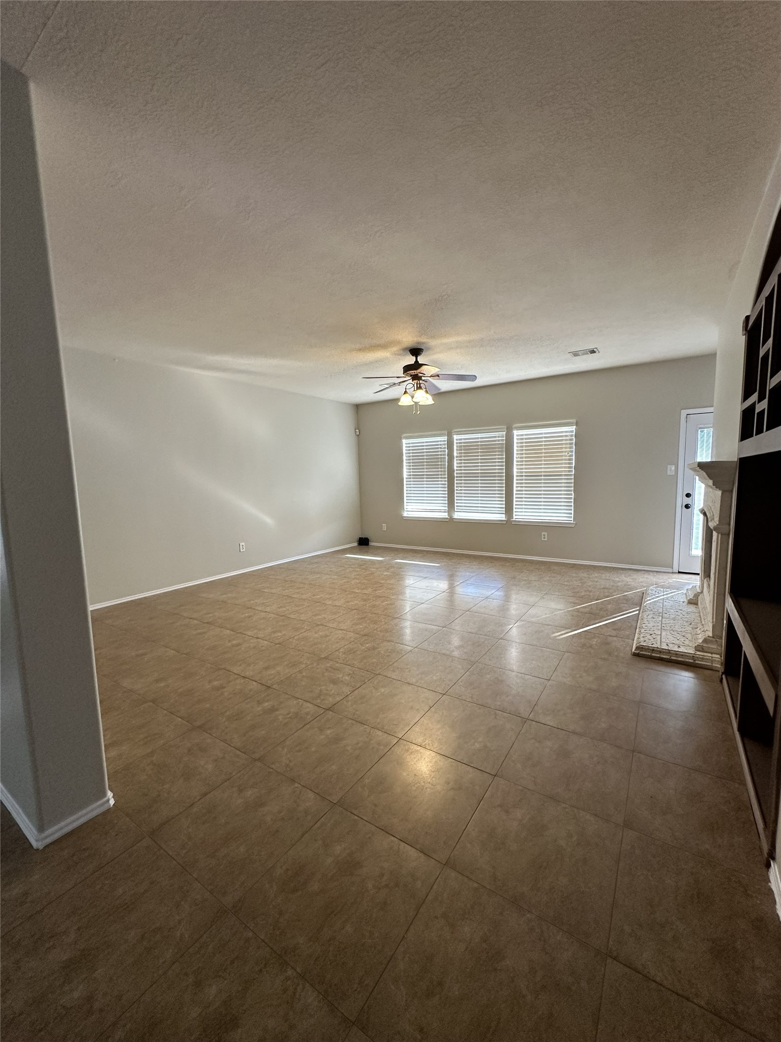 3410 Azalea Sands Drive Spring, TX 77386 - Photo 17 of 40 a view of a livingroom with a fireplace