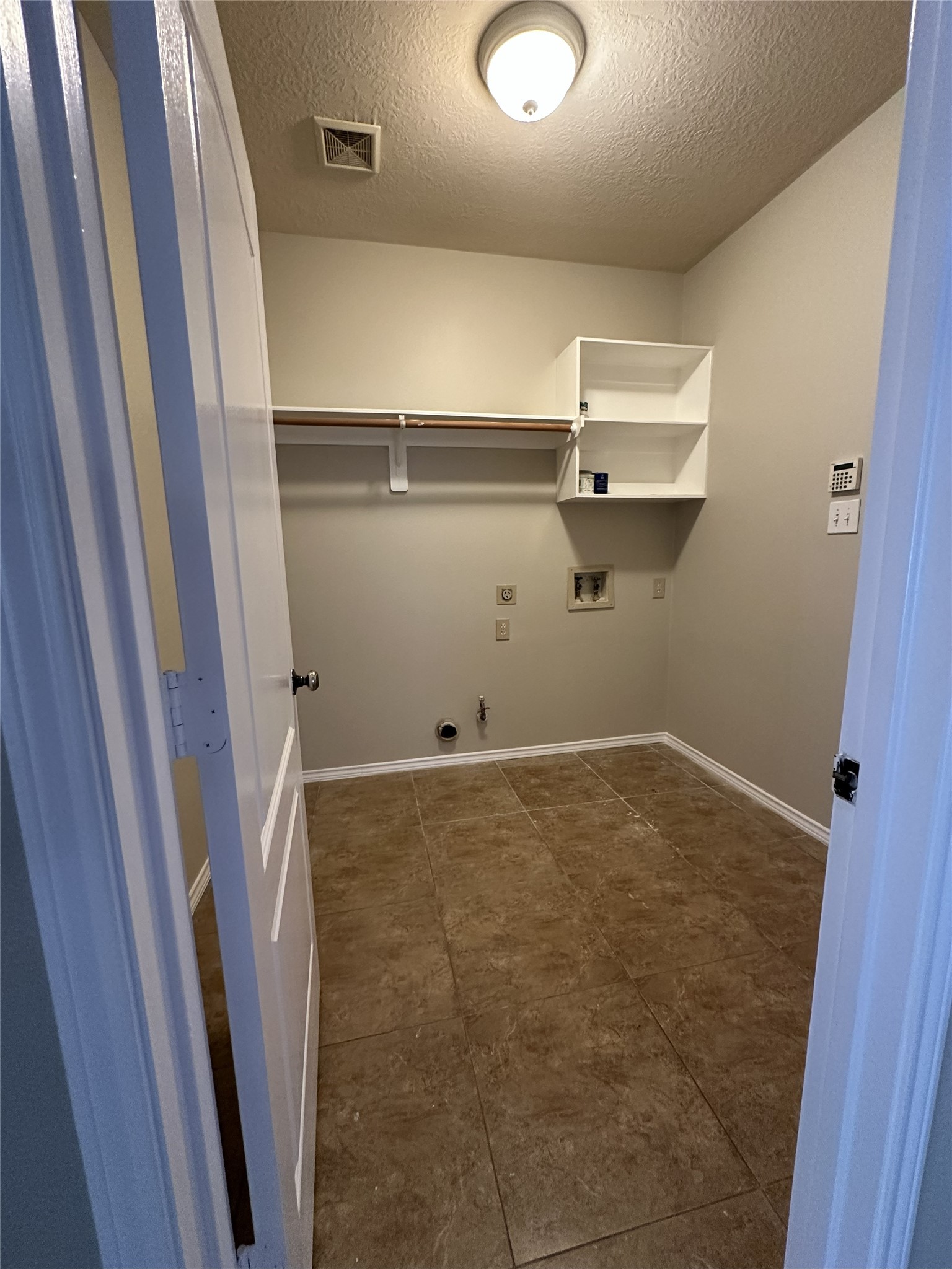 3410 Azalea Sands Drive Spring, TX 77386 - Photo 20 of 40 a view of a room with racks on the wall
