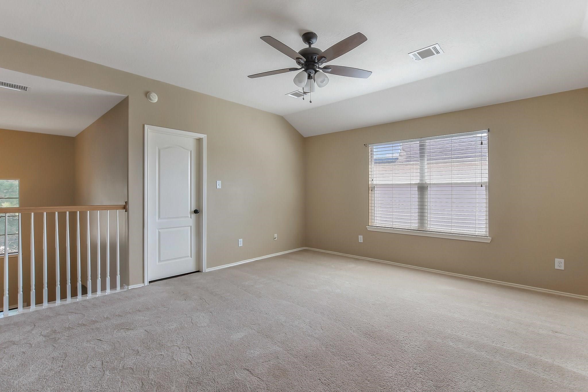 3410 Azalea Sands Drive Spring, TX 77386 - Photo 28 of 40 a view of a livingroom with a ceiling fan and window