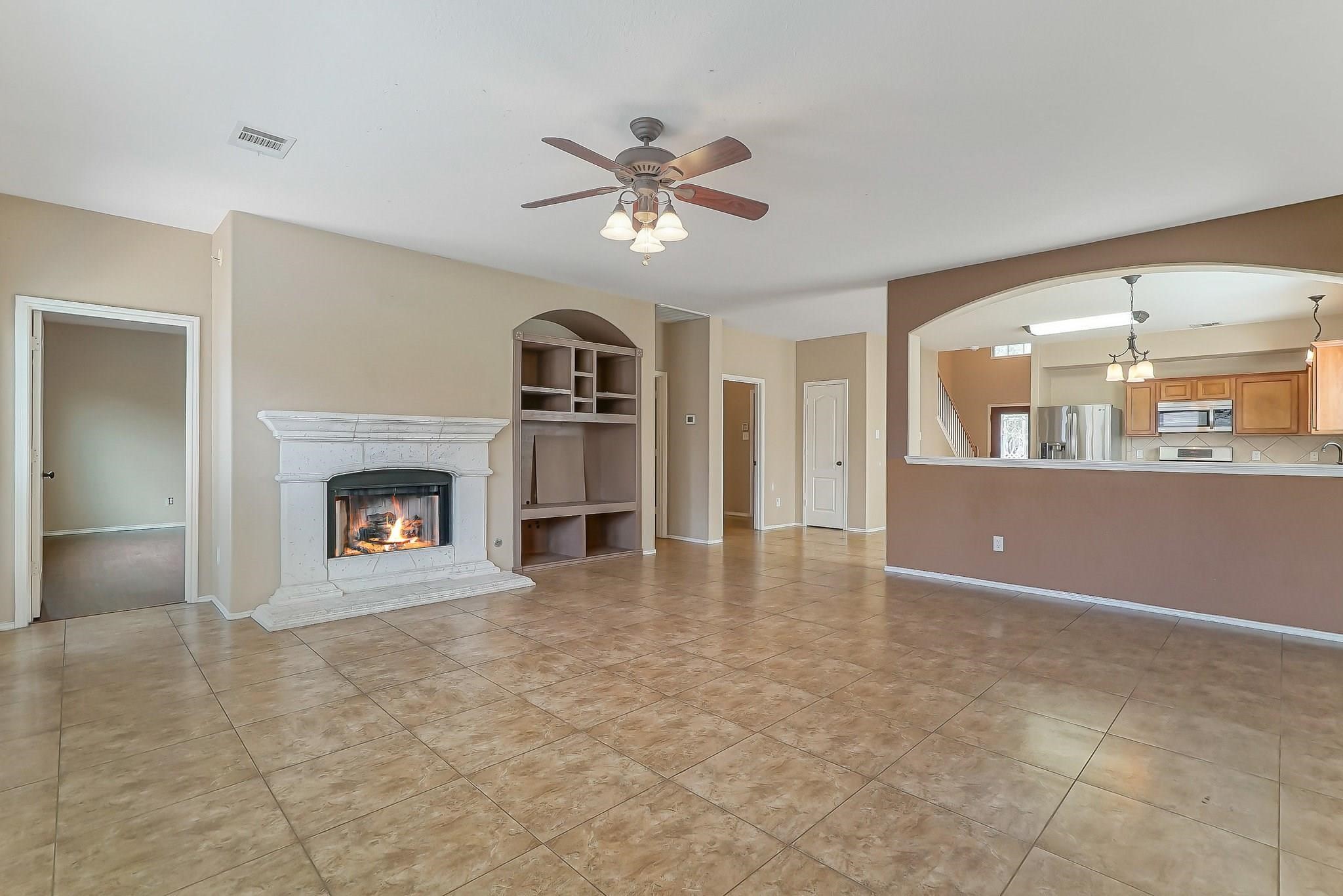 3410 Azalea Sands Drive Spring, TX 77386 - Photo 32 of 40 a view of a livingroom with a fireplace and window