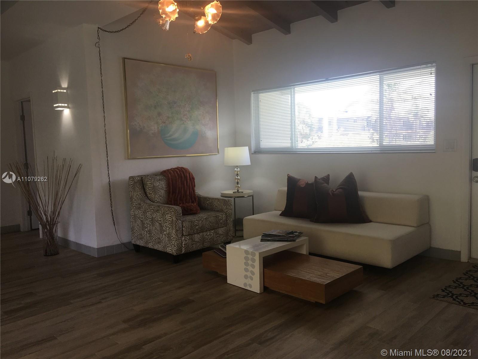 524 North Riverside Drive Pompano Beach, FL 33062 - Photo 11 of 35 a living room with furniture and a window