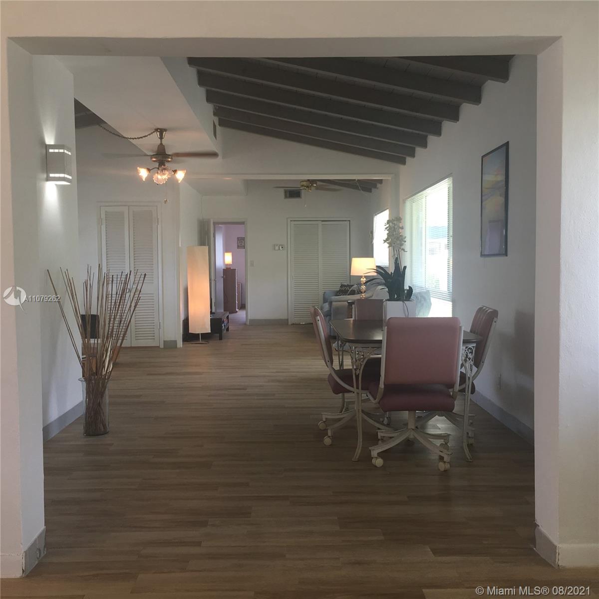 524 North Riverside Drive Pompano Beach, FL 33062 - Photo 14 of 35 a view of a dining room with furniture and wooden floor