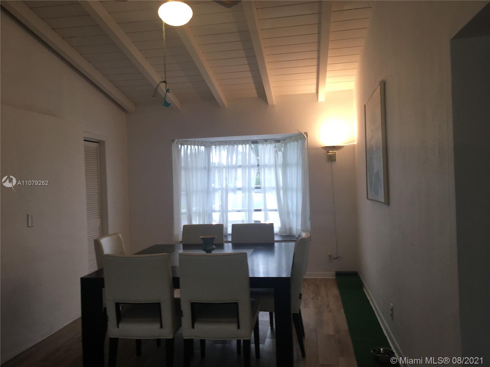 524 North Riverside Drive Pompano Beach, FL 33062 - Photo 20 of 35 a view of a dining room with furniture and window
