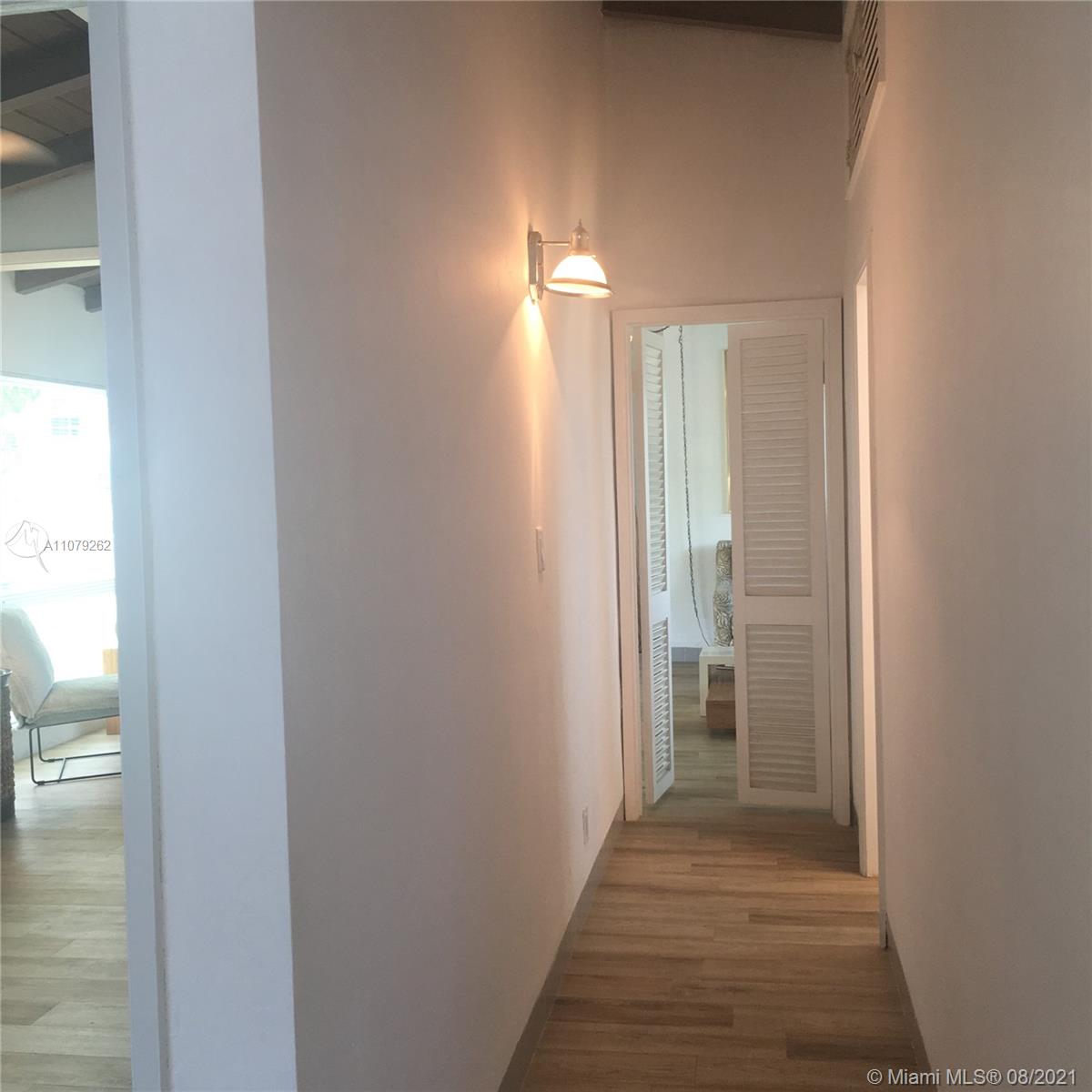 524 North Riverside Drive Pompano Beach, FL 33062 - Photo 21 of 35 a view of a bathroom from a hallway