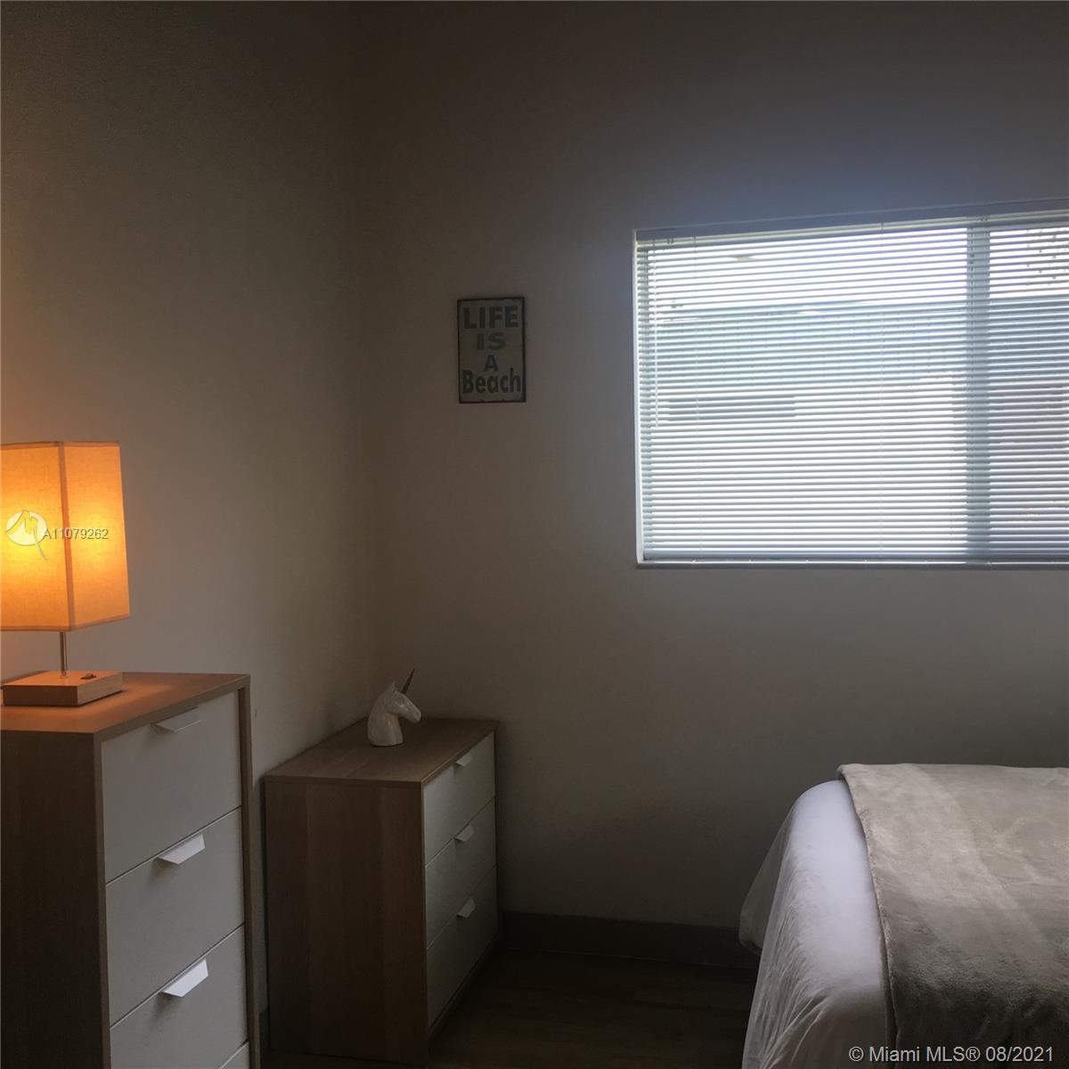 524 North Riverside Drive Pompano Beach, FL 33062 - Photo 28 of 35 a room with a bed and a window