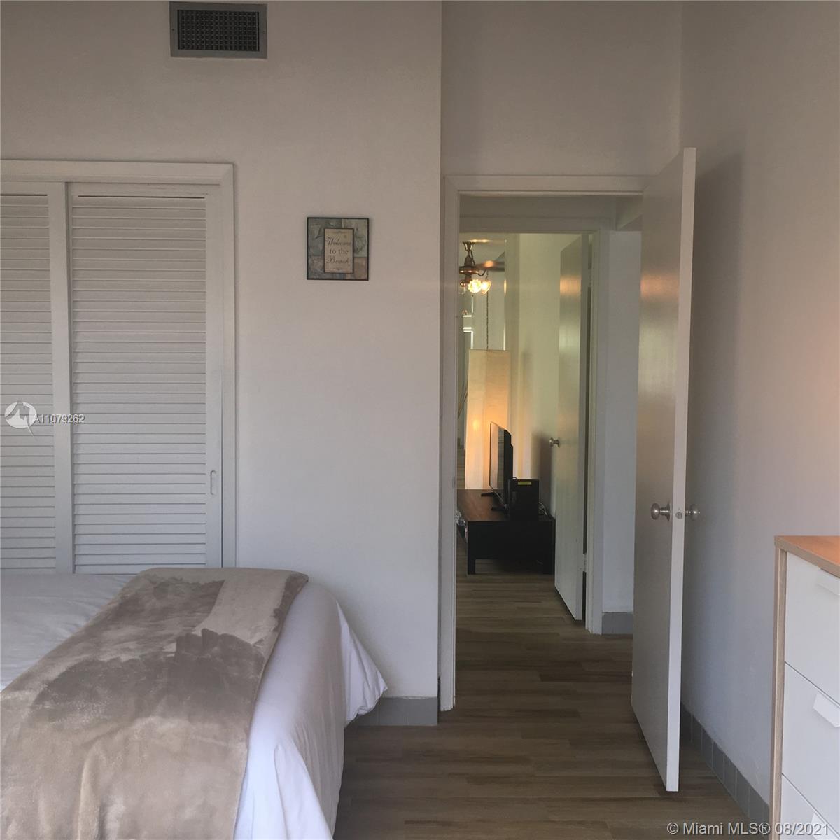 524 North Riverside Drive Pompano Beach, FL 33062 - Photo 29 of 35 a view of a bedroom from a hallway