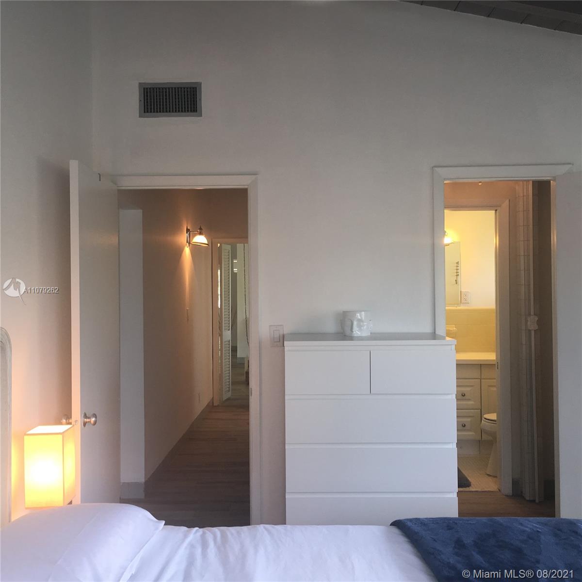 524 North Riverside Drive Pompano Beach, FL 33062 - Photo 31 of 35 a view of walk in closet and bedroom