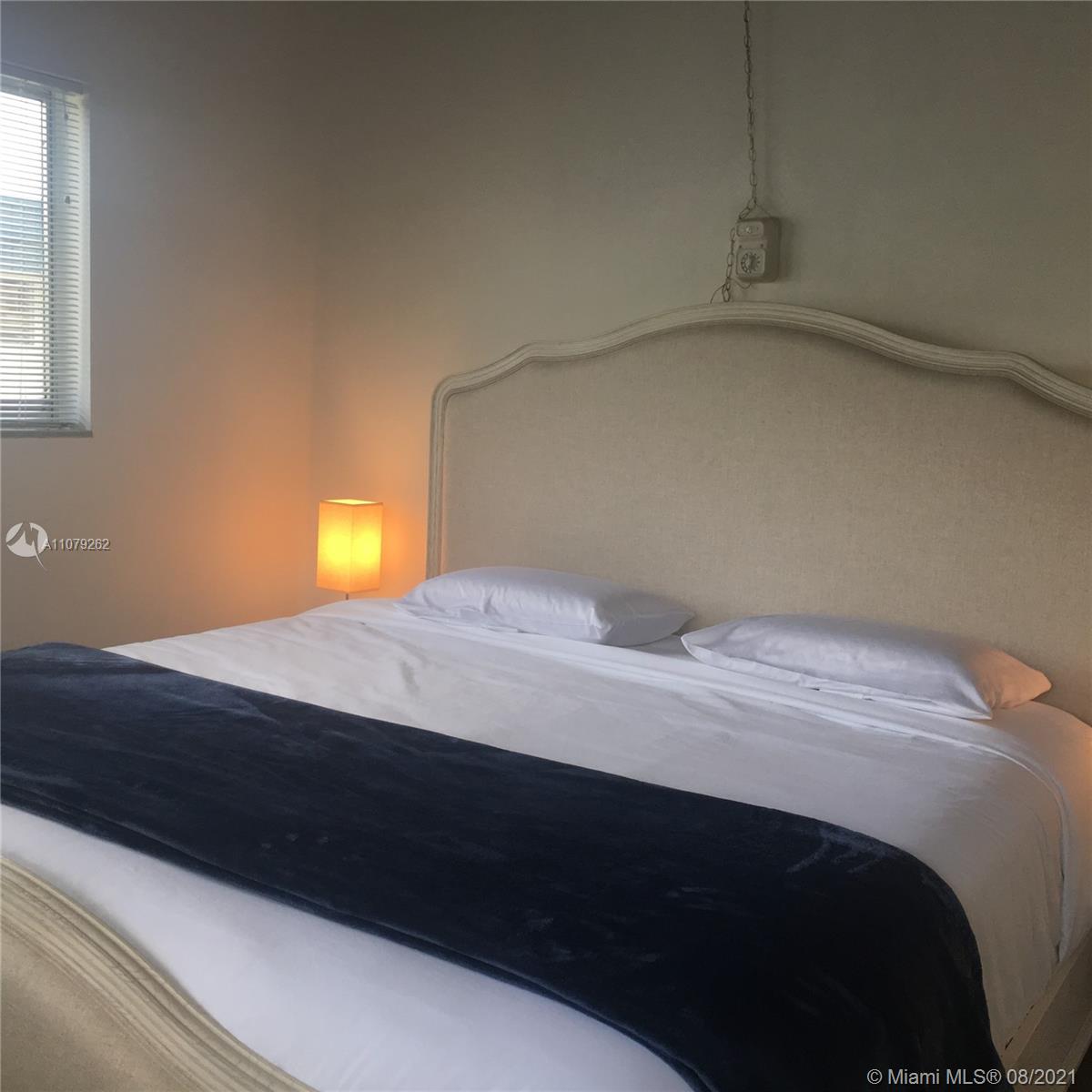 524 North Riverside Drive Pompano Beach, FL 33062 - Photo 33 of 35 a bedroom with a bed and window