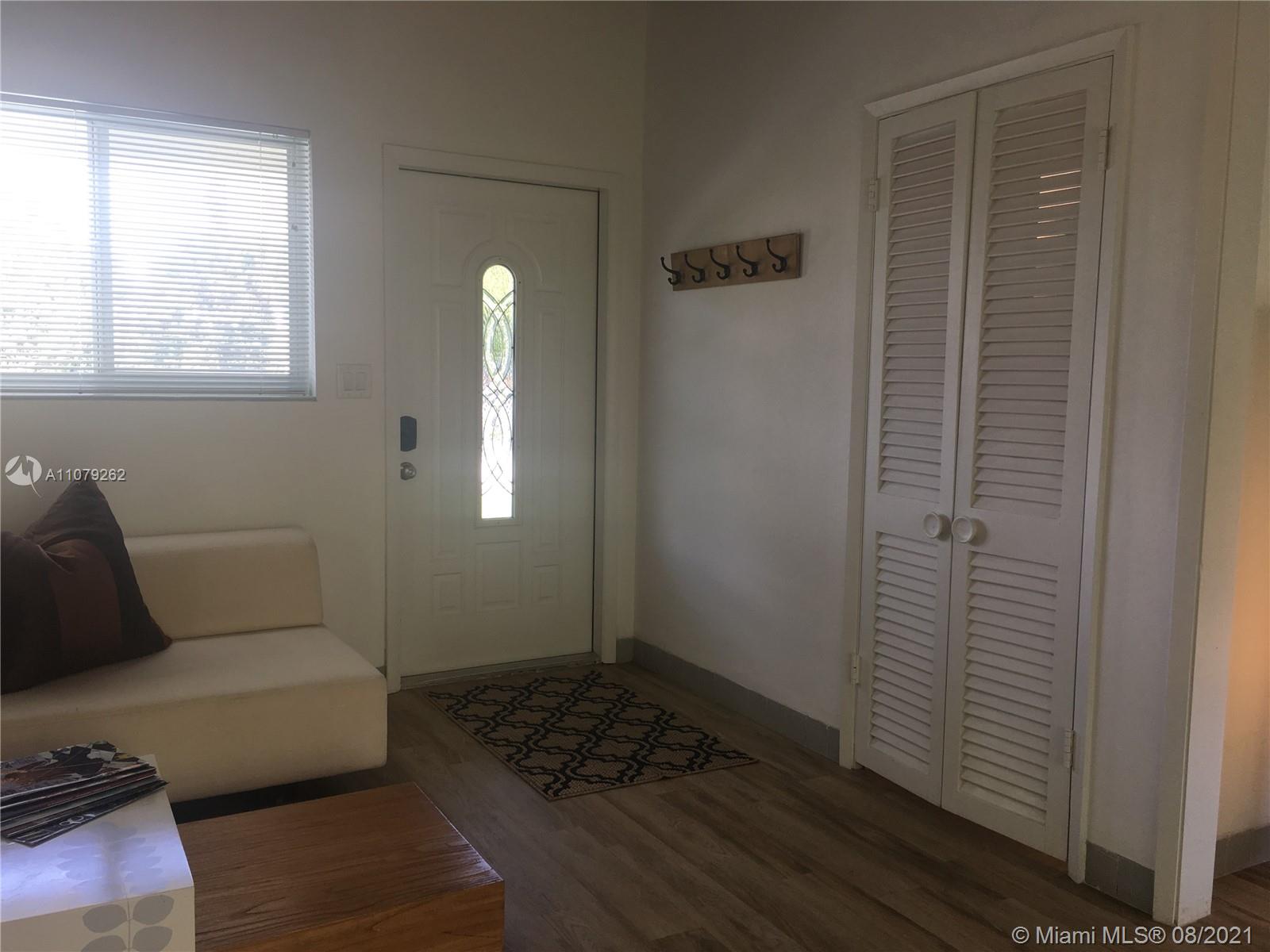 524 North Riverside Drive Pompano Beach, FL 33062 - Photo 6 of 35 a living room with furniture and a window