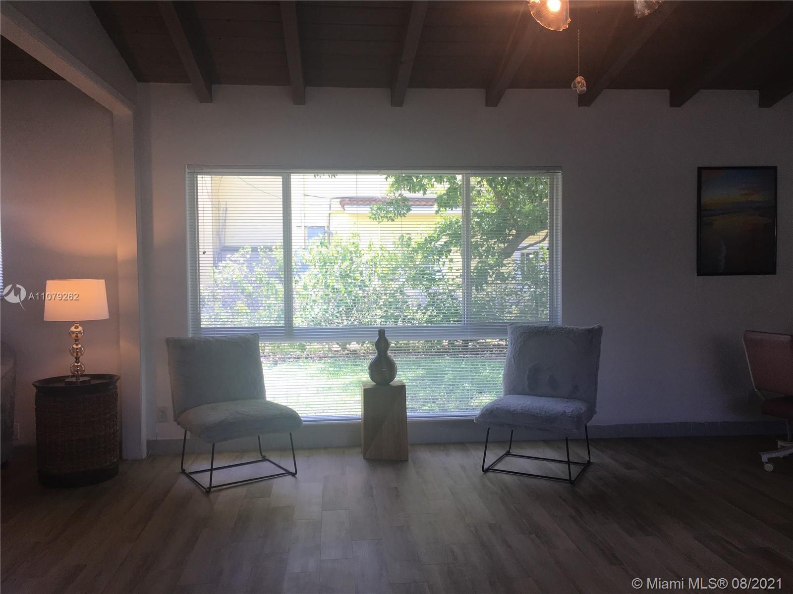 524 North Riverside Drive Pompano Beach, FL 33062 - Photo 10 of 35 a living room with furniture and a window