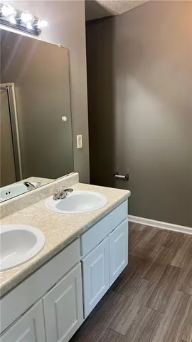 a white toilet sitting next to a bathroom sink