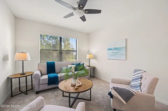a living room with furniture and a window