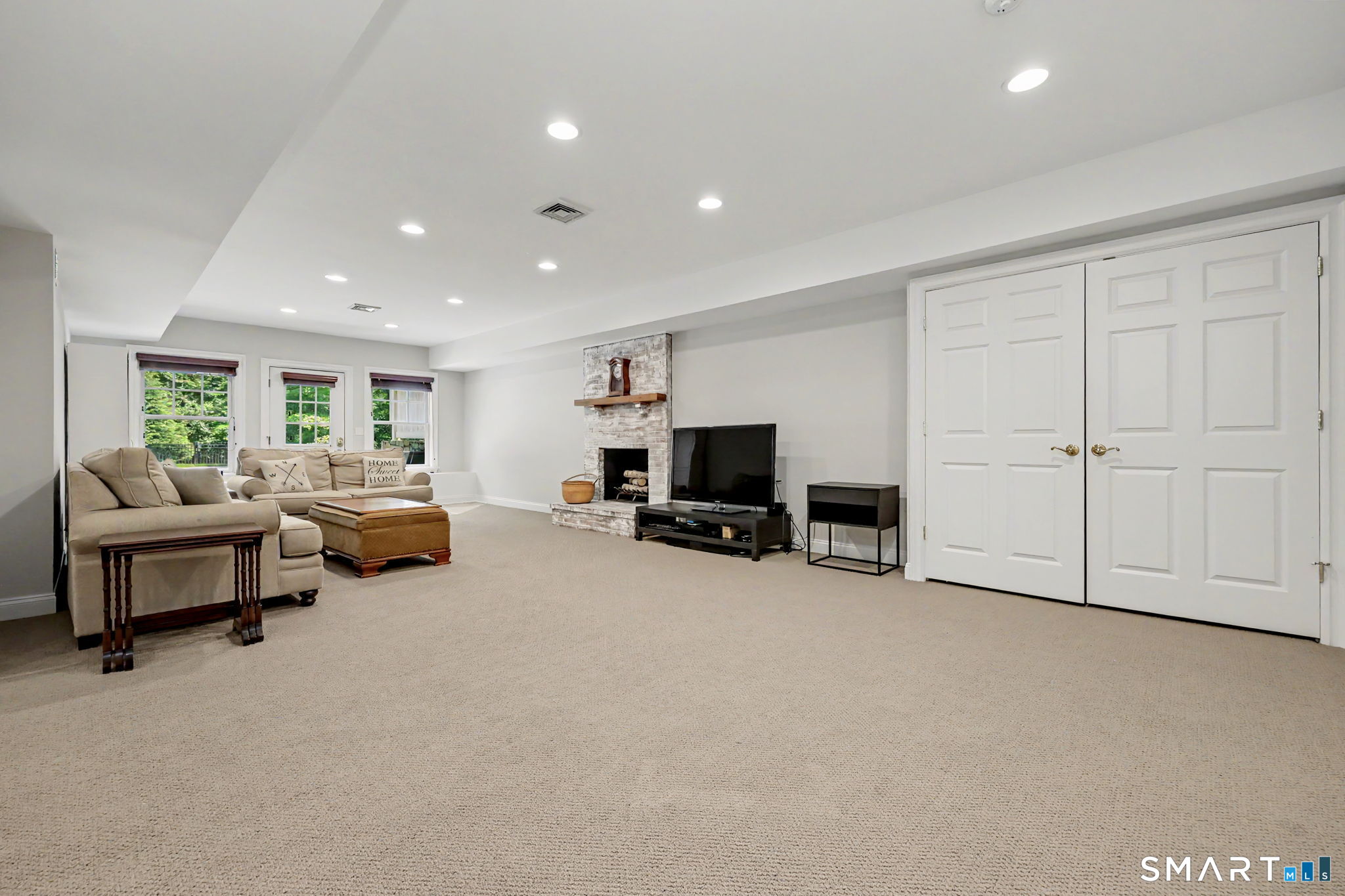 58 Fanton Hill Road Weston, CT 06883 - Photo 30 of 38 Lower level den with walk out to yard and pool