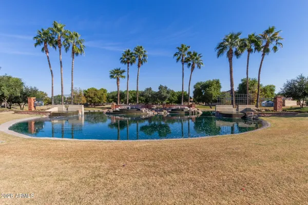 a view of swimming pool with a table and chairs