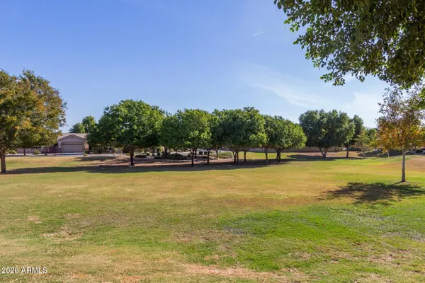 a view of a swimming pool with an outdoor space and seating area