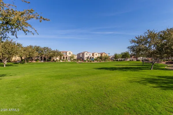 a view of a golf course with a lake