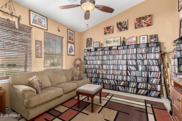 a living room with furniture a rug and a chandelier