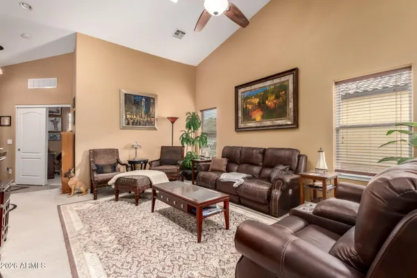 a living room with furniture and a rug