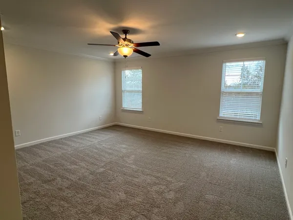 a spacious bathroom with a double vanity sink and a mirror