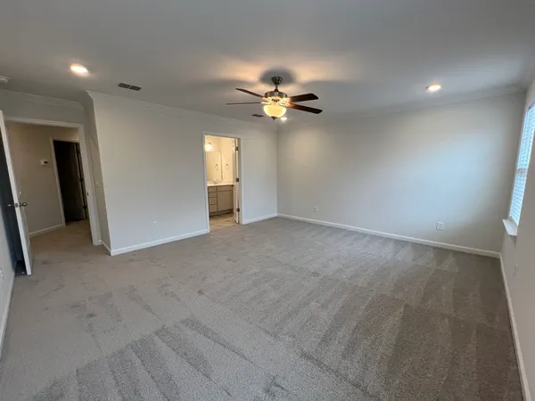 a bathroom with a glass shower door