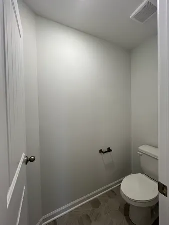 an empty room with a empty space and windows