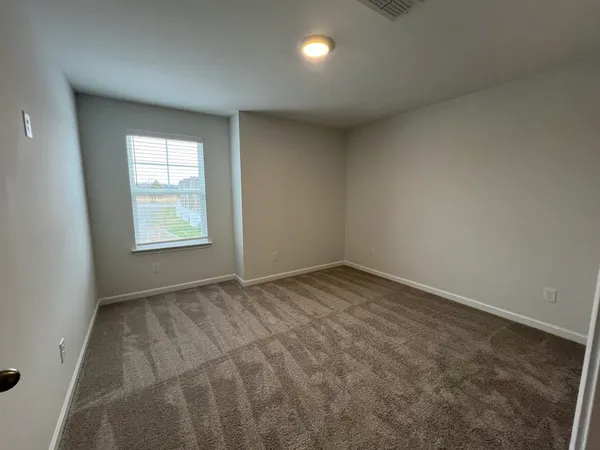 a view of a house with a large window