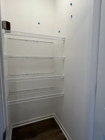 a view of hallway with closet area