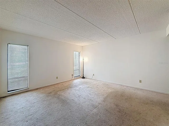 a view of an empty room and a window