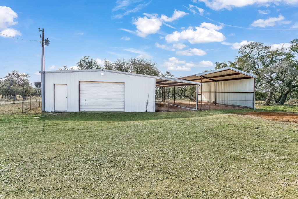 20400 Fm 2093 Harper, TX 78631 - Photo 13 of 39 a front view of a house with garden