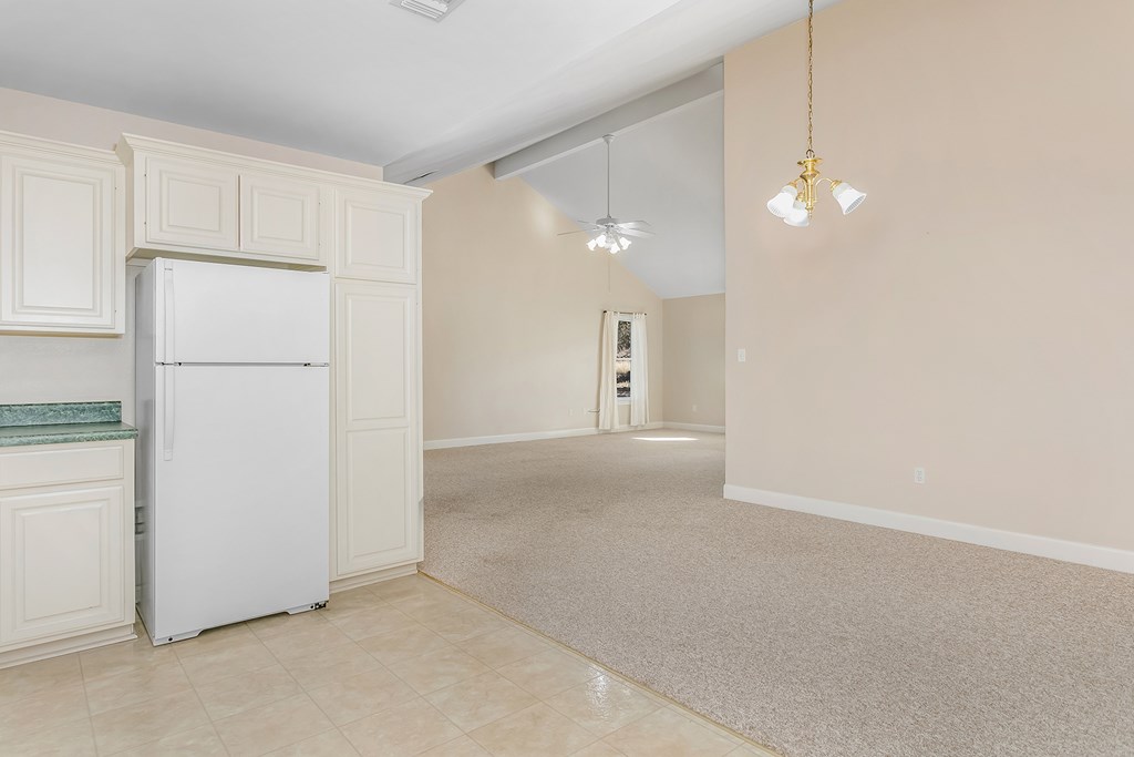 20400 Fm 2093 Harper, TX 78631 - Photo 17 of 39 a view of a kitchen with a refrigerator and cabinets