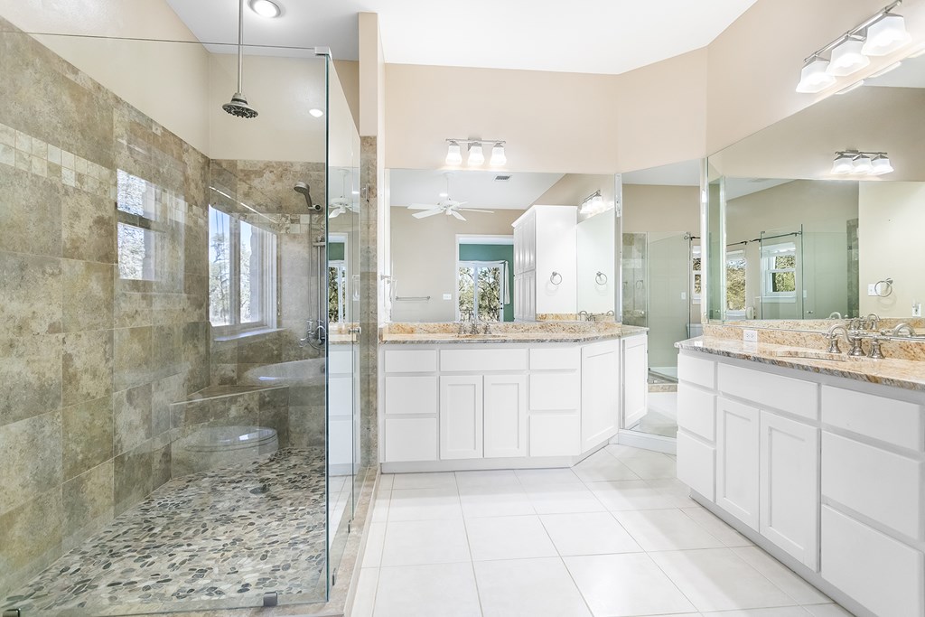20400 Fm 2093 Harper, TX 78631 - Photo 8 of 39 a bathroom with a granite countertop sink mirror and shower