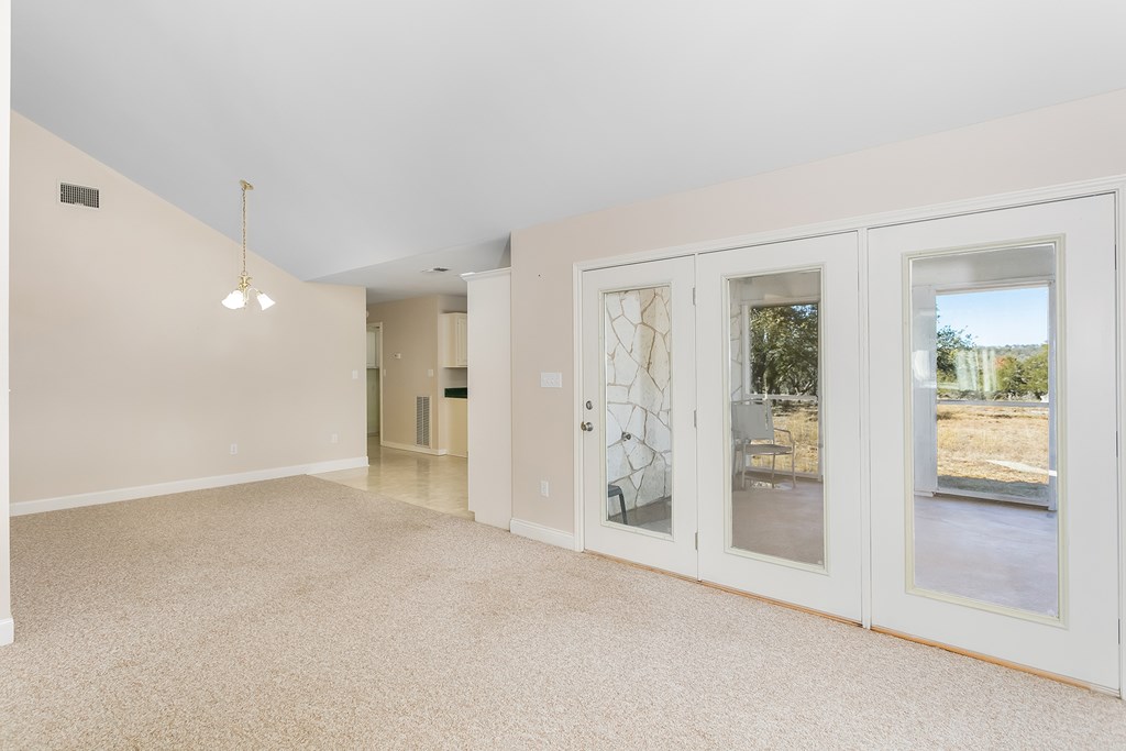 20400 Fm 2093 Harper, TX 78631 - Photo 9 of 39 wooden floor in an empty room with a window