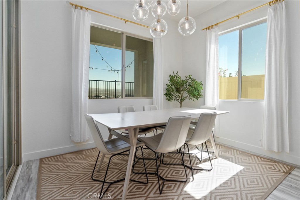 2308 Nova Way Corona, CA 92883 - Photo 14 of 32 a view of a dining room with furniture and window