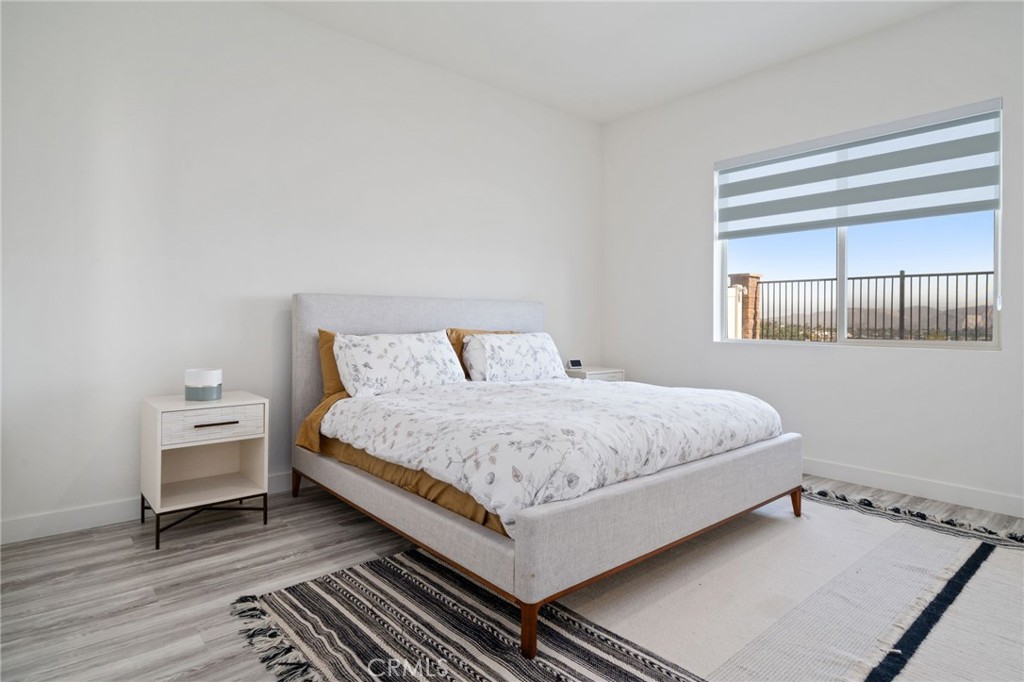 2308 Nova Way Corona, CA 92883 - Photo 15 of 32 a bedroom with a bed and window