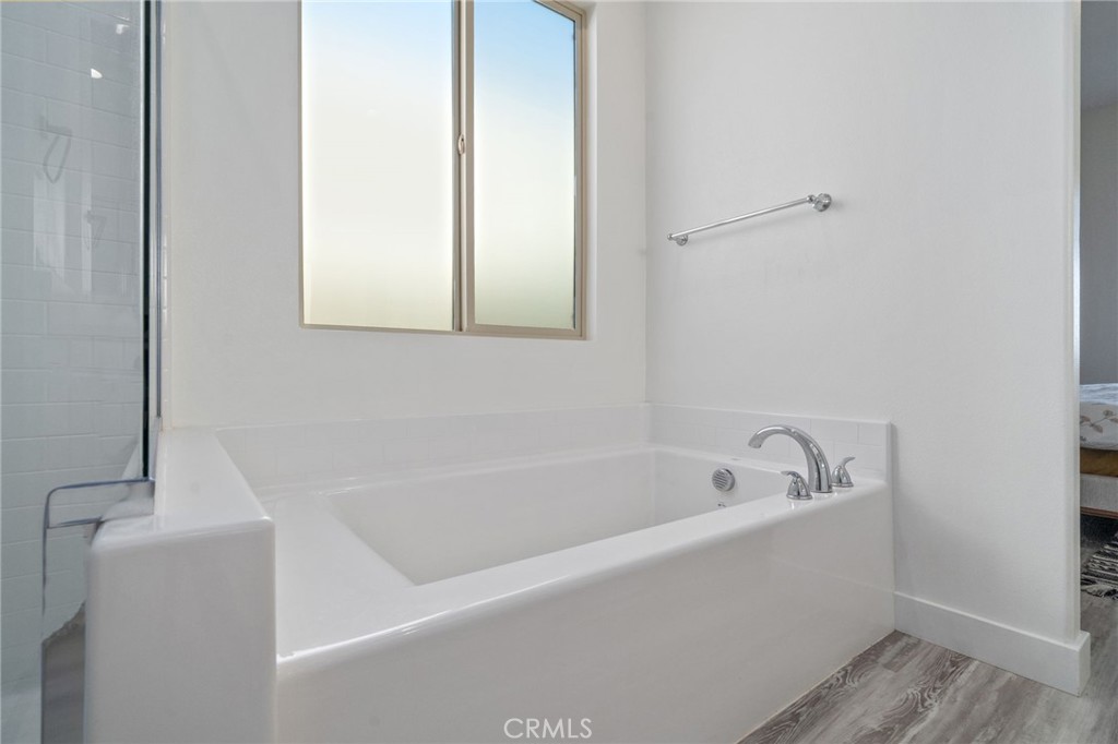 2308 Nova Way Corona, CA 92883 - Photo 18 of 32 a white bath tub sitting next to a white sink