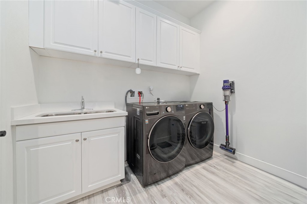 2308 Nova Way Corona, CA 92883 - Photo 20 of 32 a utility room with dryer and washer