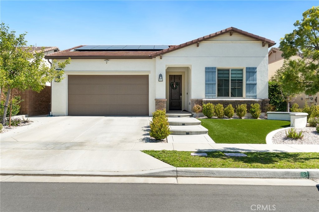 2308 Nova Way Corona, CA 92883 - Photo 2 of 32 a front view of a house with a yard