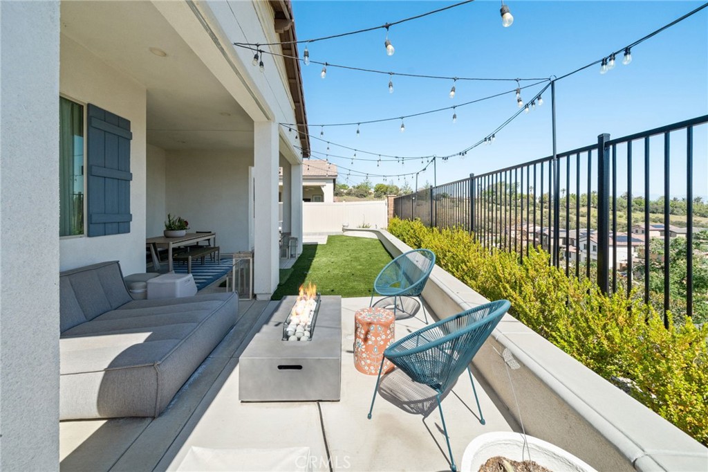 2308 Nova Way Corona, CA 92883 - Photo 26 of 32 a living room with a couch and a potted plant
