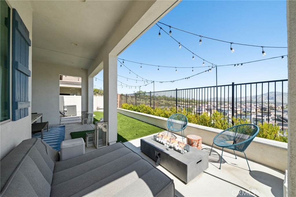 2308 Nova Way Corona, CA 92883 - Photo 27 of 32 a living room with furniture and a large window