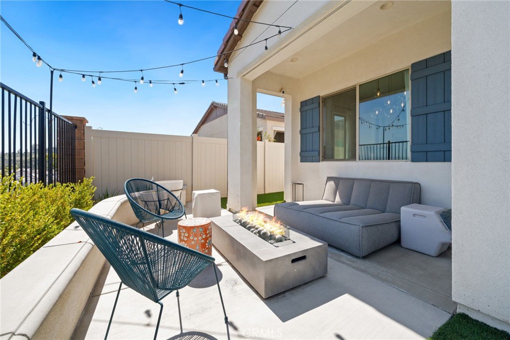 2308 Nova Way Corona, CA 92883 - Photo 29 of 32 a living room with furniture and a table