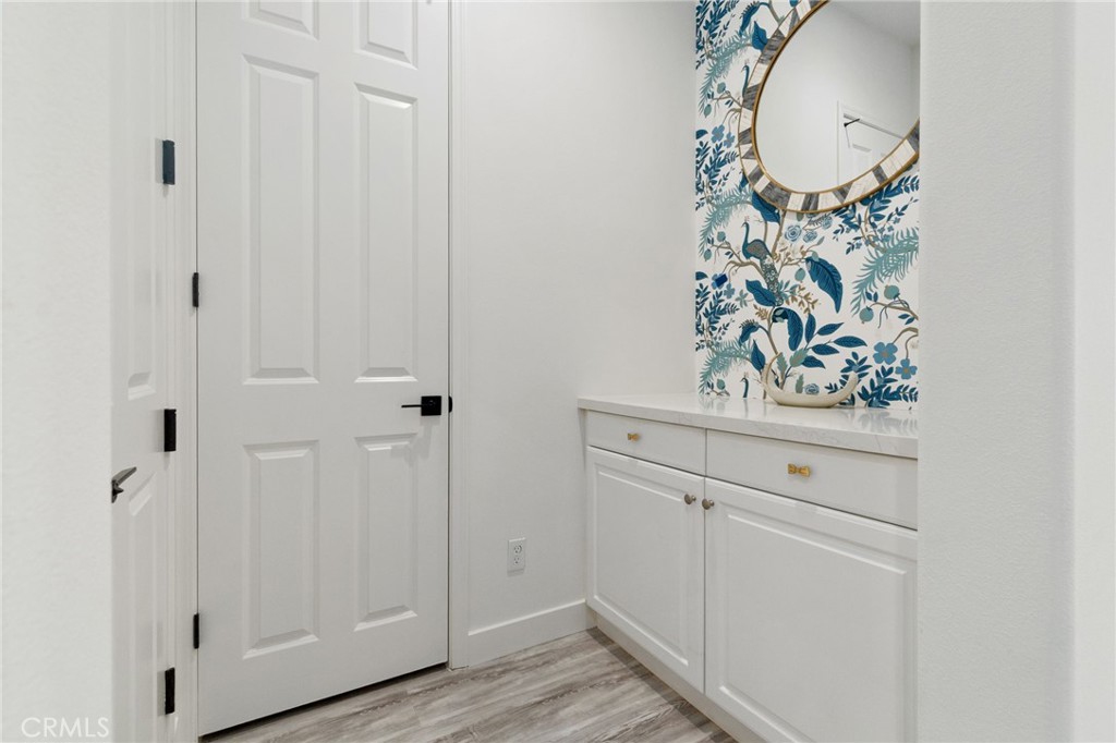 2308 Nova Way Corona, CA 92883 - Photo 5 of 32 a view of a hallway with wooden floor