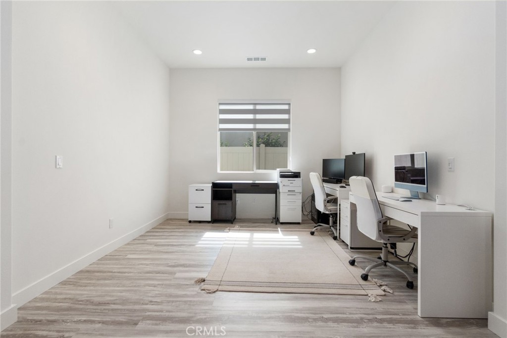2308 Nova Way Corona, CA 92883 - Photo 7 of 32 a workspace with furniture hardwood and a window