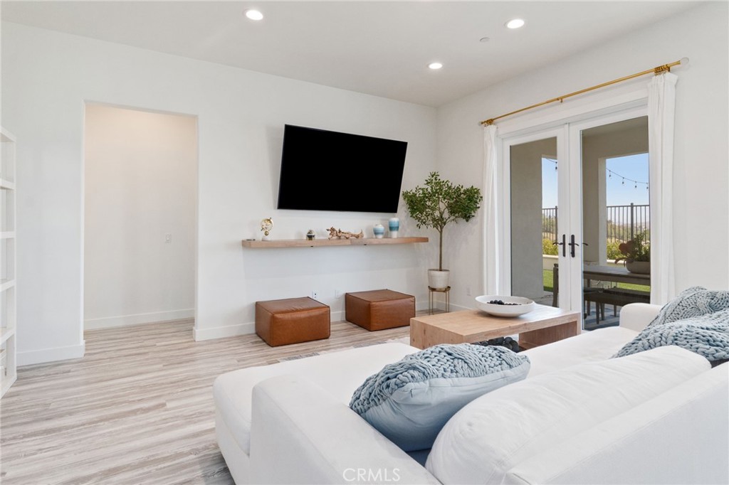 2308 Nova Way Corona, CA 92883 - Photo 8 of 32 a bedroom with furniture and a flat screen tv