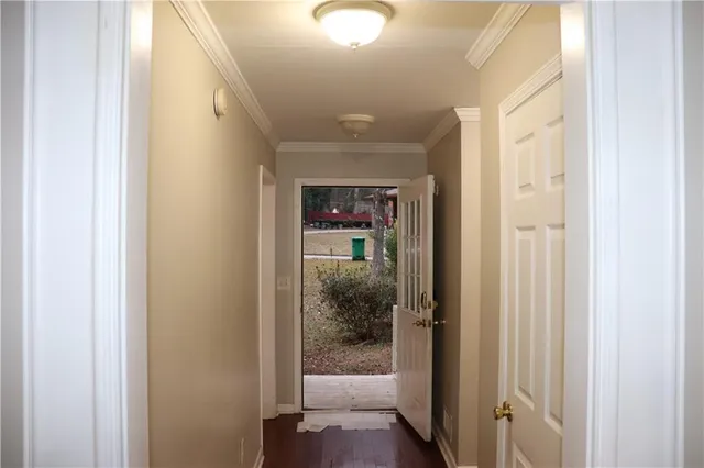 a view of a house with wooden fence