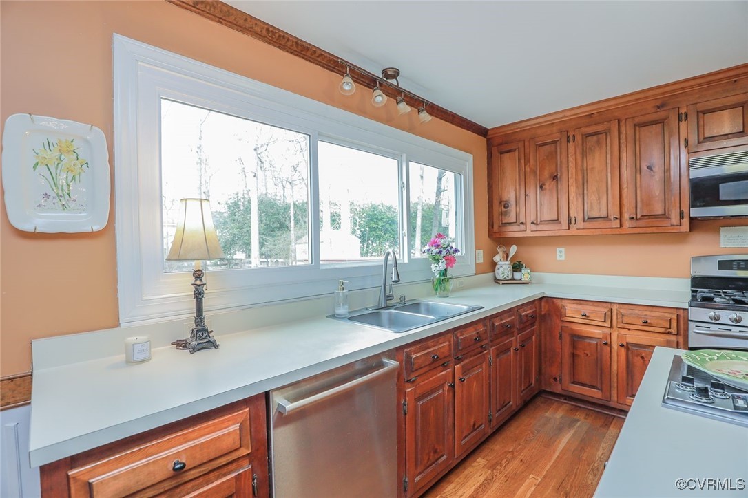 2400 Olde Stone Road Midlothian, VA 23113 - Photo 11 of 48 a kitchen with stainless steel appliances wooden cabinets a sink and a large window