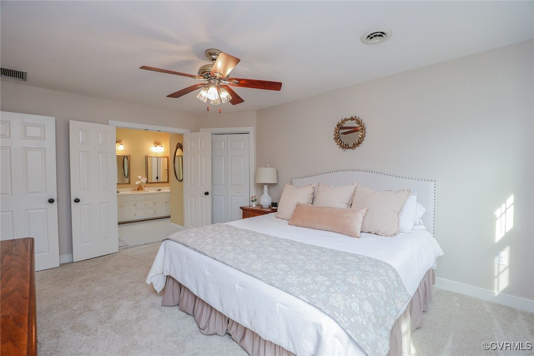 2400 Olde Stone Road Midlothian, VA 23113 - Photo 27 of 48 a bedroom with a bed and a chandelier