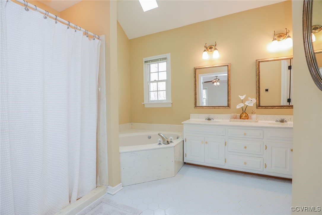 2400 Olde Stone Road Midlothian, VA 23113 - Photo 28 of 48 a spacious bathroom with a double vanity sink a mirror and a bathtub