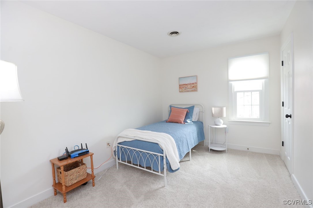 2400 Olde Stone Road Midlothian, VA 23113 - Photo 29 of 48 a room with a bed and a window