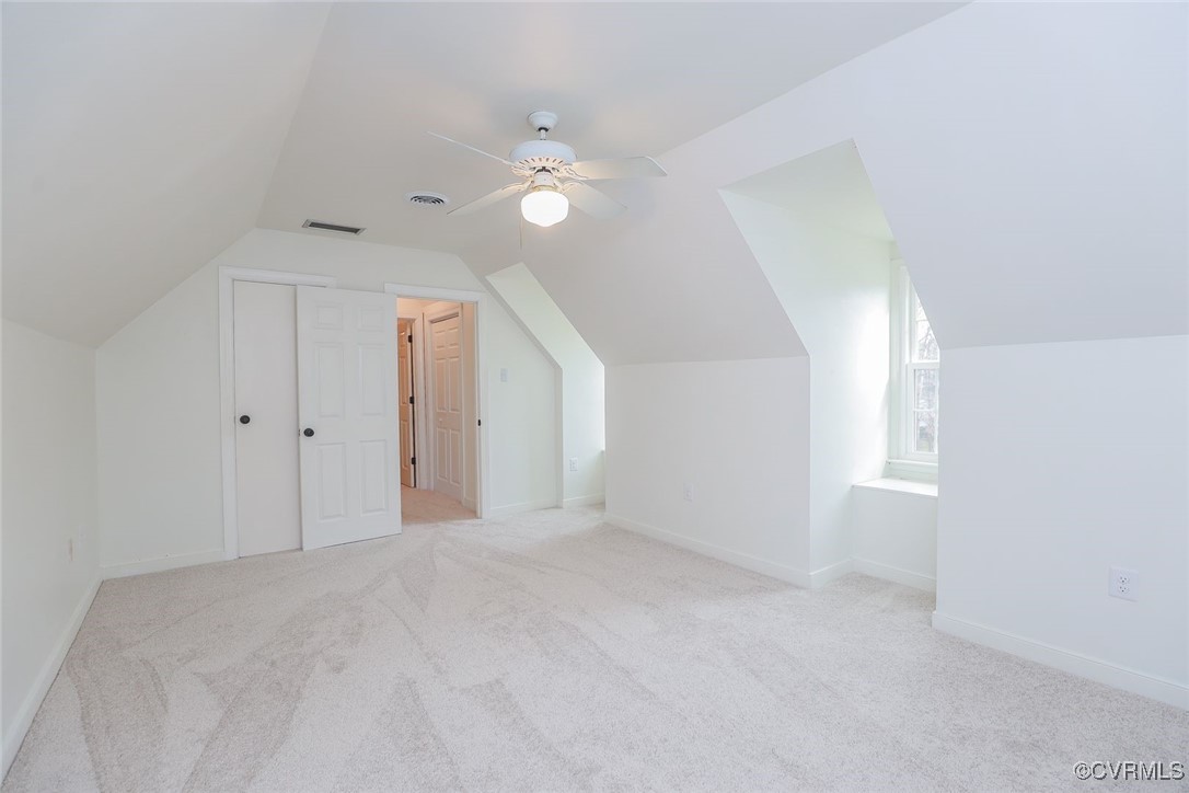 2400 Olde Stone Road Midlothian, VA 23113 - Photo 34 of 48 a view of a big room with windows and chandelier fan